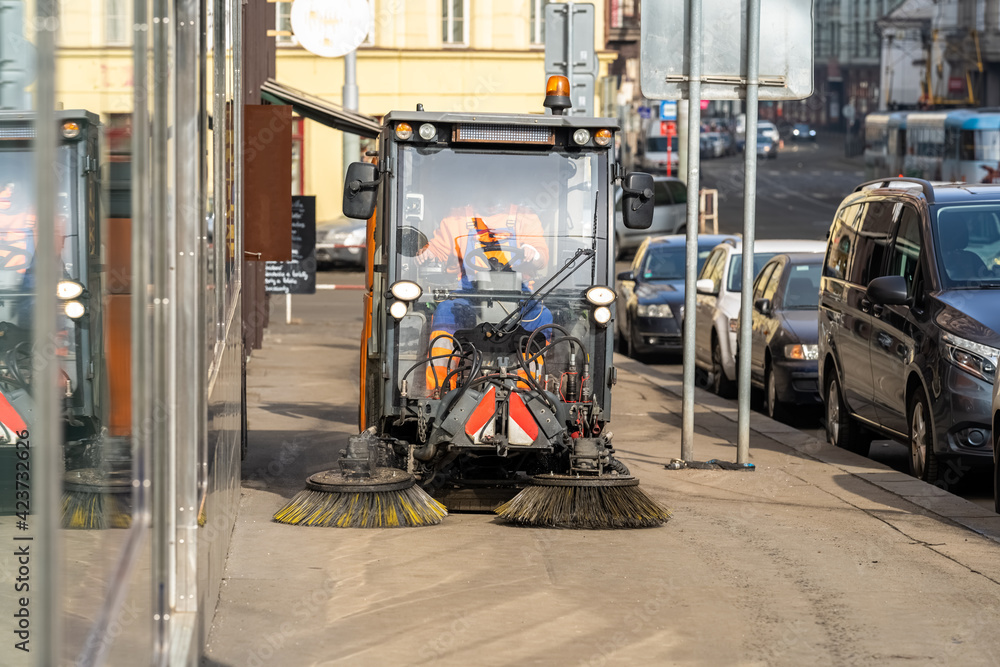 Naklejka premium machine cleaning of city streets