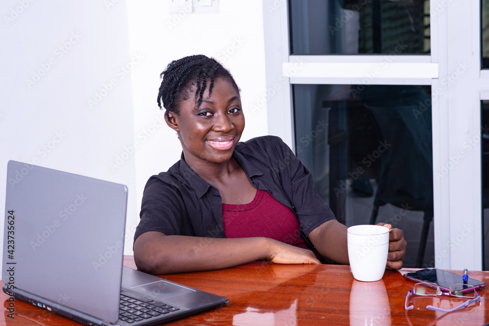 young businesswoman smiling at office. young businesswoman smiling at office.