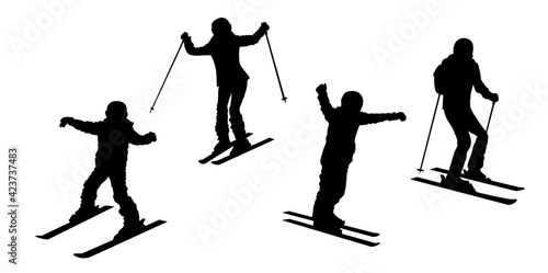 Happy family skiing vector silhouette. Father, mother and chindren having fun.