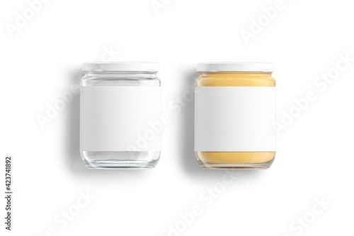 Blank glass jar with white label and peanut butter mockup photo