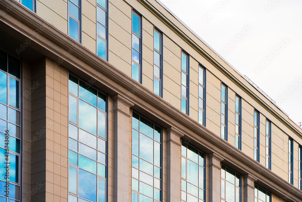Multistorey residential or business modern building with blue sky