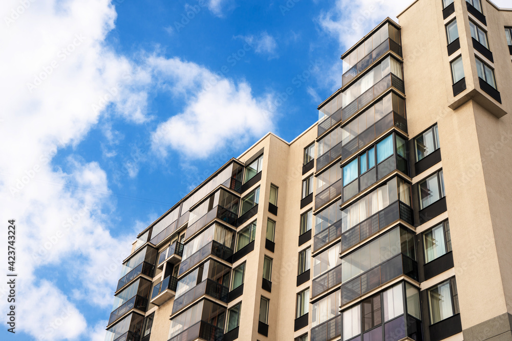 Multistorey residential or business modern building with blue sky Multistorey residential or business modern building with blue sky