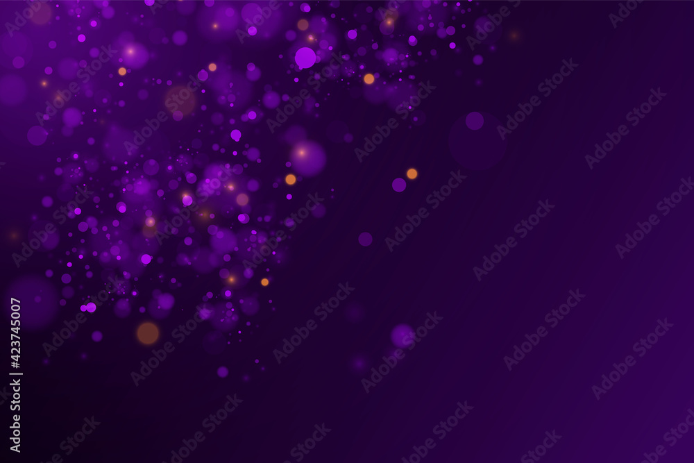 Sparkling magical dust and purple blue particles on black background.