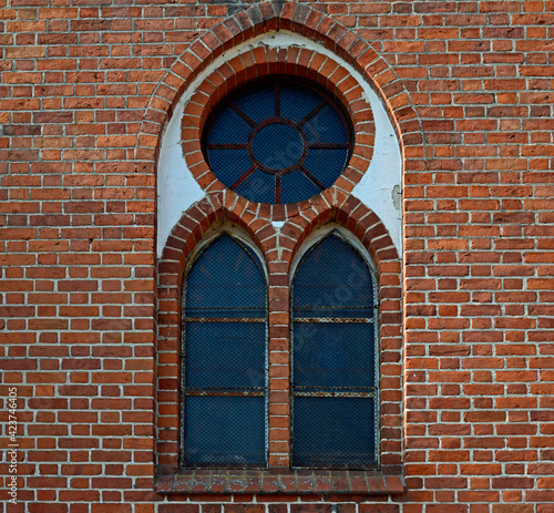 brick neo-gothic Catholic church of Our Lady of Gietrzwałd, erected at the beginning of the 20th century, in the village of a gentry cauldron in Masuria, Poland