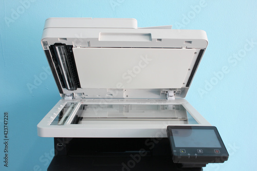 photocopier is a machine that makes paper copies of documents and other visual images ,close-up multi-function device, printer scanner, copier.