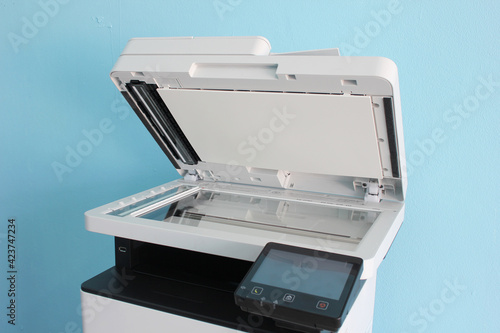 photocopier is a machine that makes paper copies of documents and other visual images ,close-up multi-function device, printer scanner, copier.