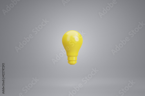 3D Rendering: Idea concept, A Yellow light bulb floats with grey background.