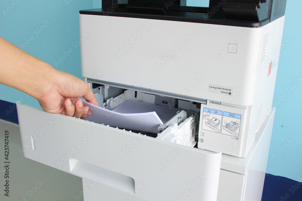Employees are Photocopying in office Employees are Photocopying in office