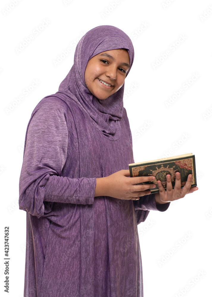 Happy Beautiful Arab Muslim Girl in Islamic Fashion Dress Holding Holy Book of Quran With Happy Smily Face Happy Beautiful Arab Muslim Girl in Islamic Fashion Dress Holding Holy Book of Quran With Happy Smily Face