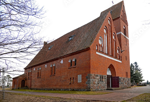 brick neo-gothic Catholic church of Our Lady of Gietrzwałd, erected at the beginning of the 20th century, in the village of a gentry cauldron in Masuria, Poland