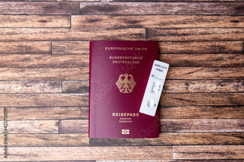 A Covid 19 antigen saliva test with a negative result is on a passport. Negative test result to be allowed to travel. Entry requirements in Germany 