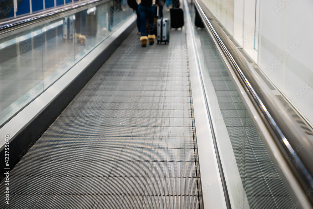 moving walkway, travelator, in airport terminal walkway for vacation travel abroad. concept of travel around world, tourism moving walkway, travelator, in airport terminal walkway for vacation travel abroad. concept of travel around world, tourism
