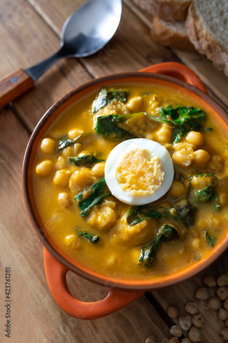 Traditional Spanish cuisine dish that is eaten mainly during the Holy Week holidays. Chickpea, cod, spinach and egg soup. Vigil Potaje.