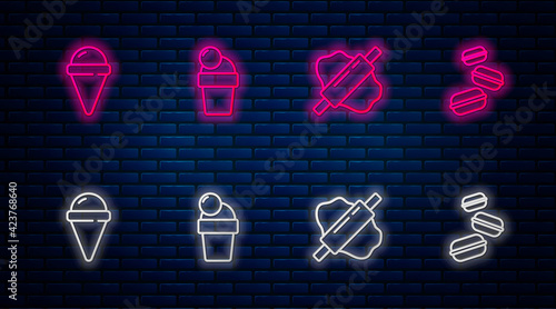 Set line Ice cream, Rolling pin on dough, waffle cone and Macaron cookie. Glowing neon icon on brick wall. Vector