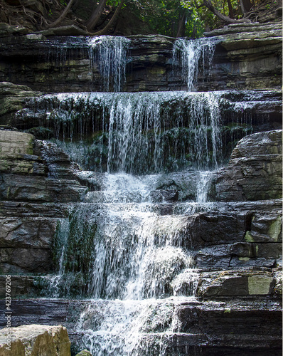 Long exposure photograph of waterfalls over rocks in summer - Princess Louise Falls