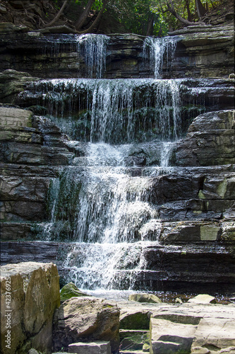 Long exposure photograph of waterfalls over rocks in summer - Princess Louise Falls