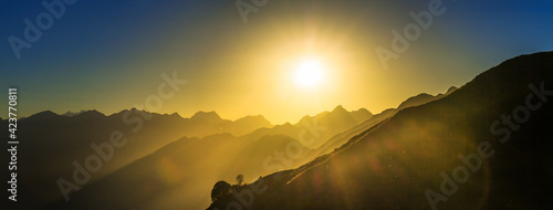 anorama landscape with sunrise over mountains