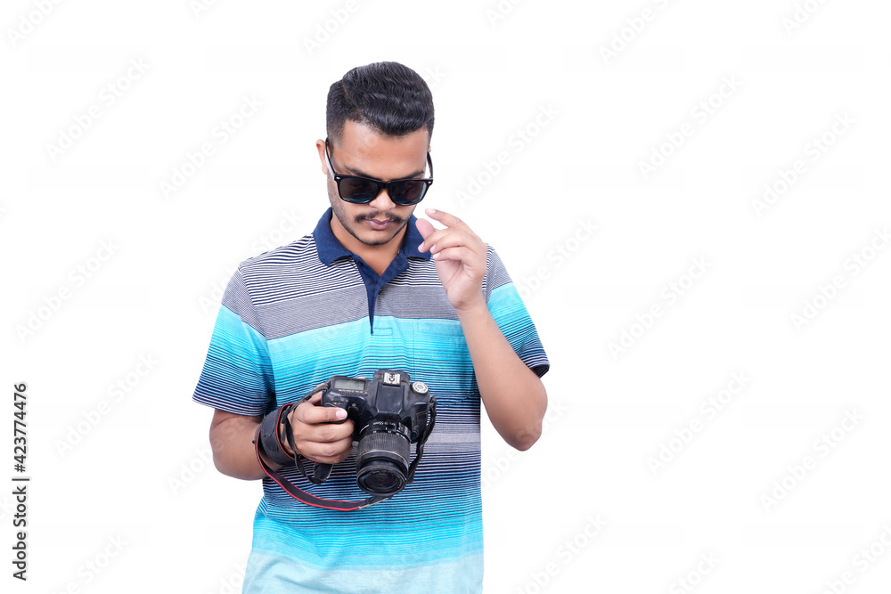 Young man taking a photo with a professional camera. Front view. Over white, all angel poses Young man taking a photo with a professional camera. Front view. Over white, all angel poses