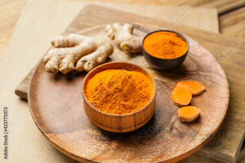 Composition with turmeric powder on table