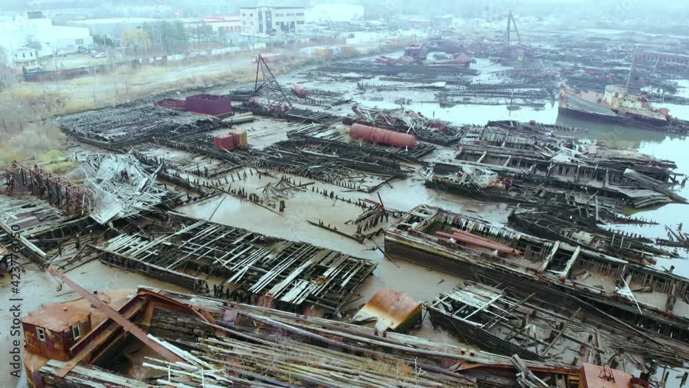 Drone flying over Staten island boat graveyard with remains of old and rusty ships and vessel. Aerial. Drone flying over Staten island boat graveyard with remains of old and rusty ships and vessel. Aerial.