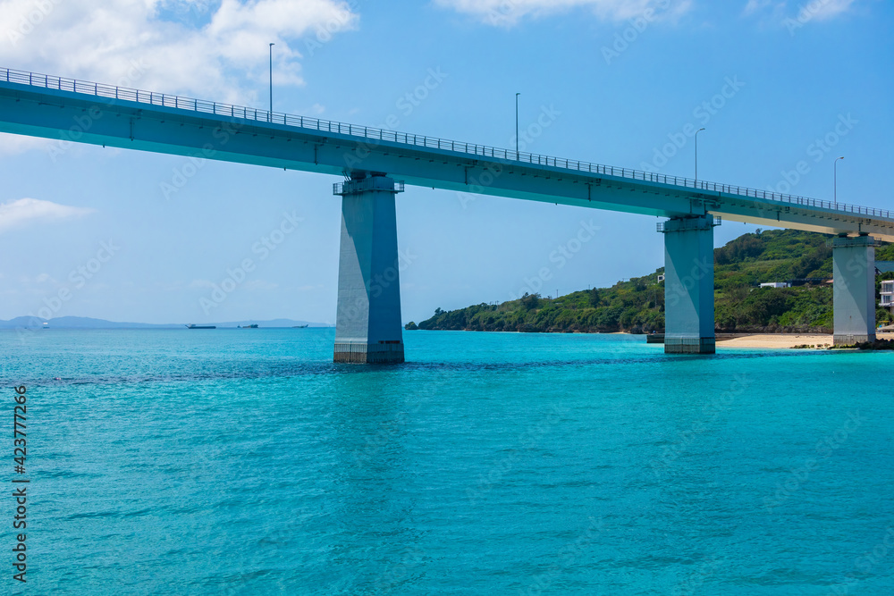 Sesoko Bridge in Okinawa, Japan daytime from Cruiser.Sesoko Bridge is a total length of 762m that connects Motobu Town and Sesoko Island.