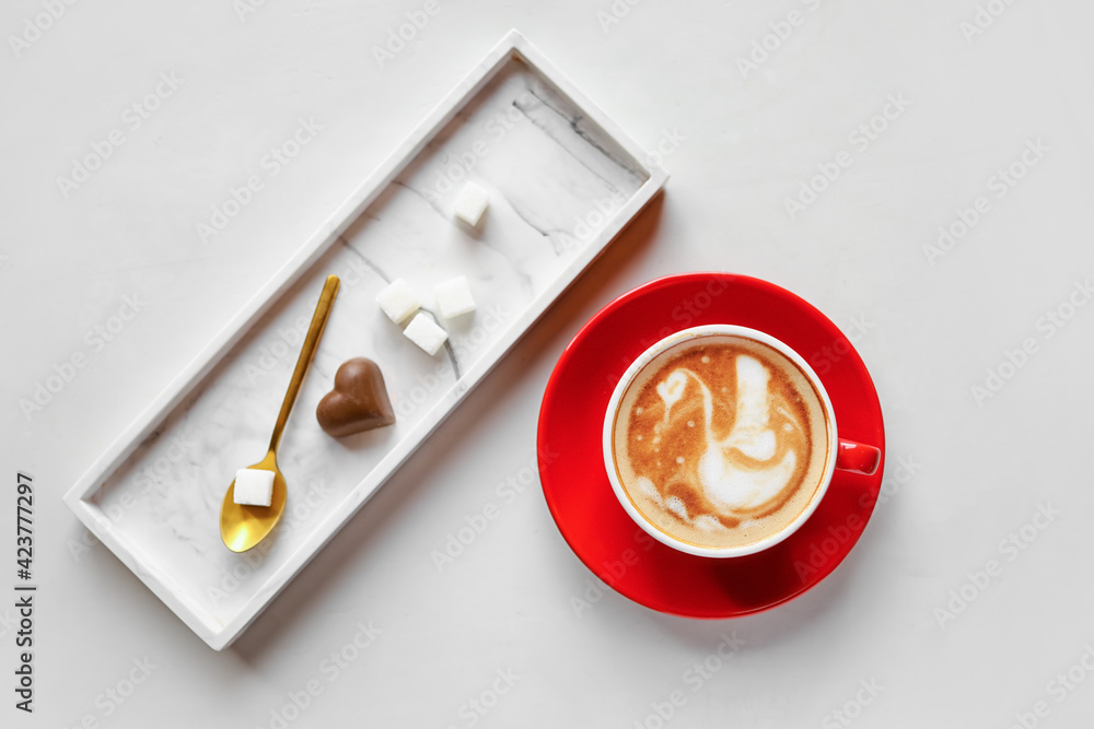 Cup of coffee with latte art on light background Cup of coffee with latte art on light background