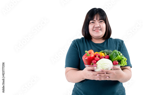 Portrait images of Asian attractive fat woman holding glass bowl contains fruit and fresh vegetables On white background and with clipping path, to woman with health food and weight loss concept.