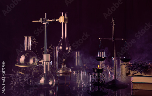 Ominous laboratory of witchcraft and magic on dark background