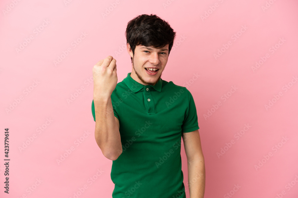 Young Russian man isolated on pink background making Italian gesture Young Russian man isolated on pink background making Italian gesture