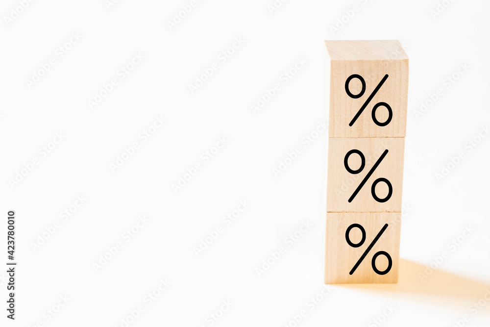 Wooden cube with percent. The concept of interest rates, financial and mortgage rates. Wooden cube with percent. The concept of interest rates, financial and mortgage rates.