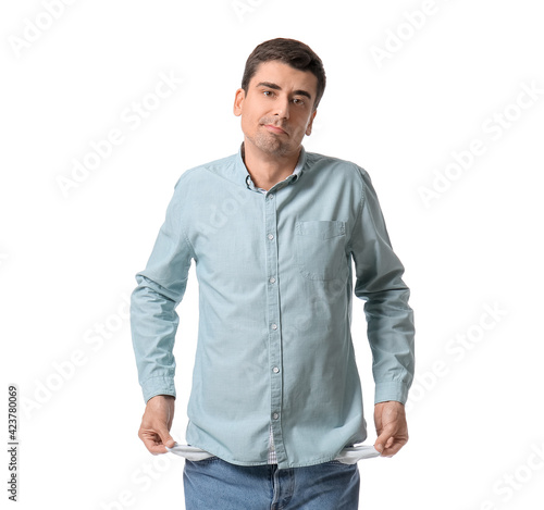 Man with empty pockets on w...