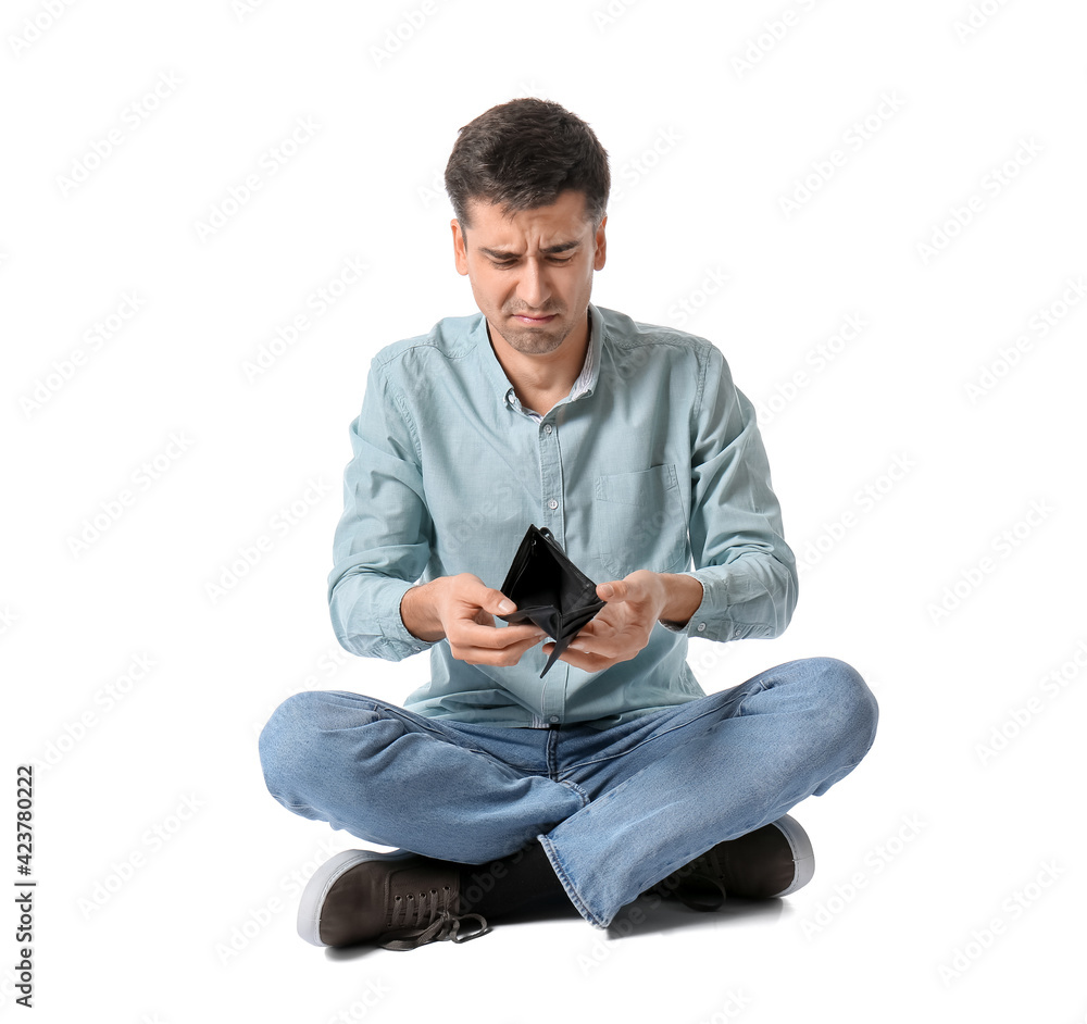 Sad man with empty wallet on white background. Bankruptcy concept Sad man with empty wallet on white background. Bankruptcy concept