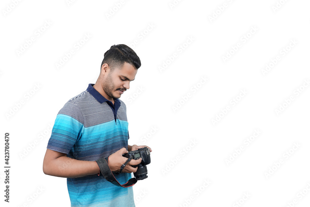 man with a professional DSLR camera, showing thumbs up, checking photos, showing the camera, operating the camera, with a blank white plate man with a professional DSLR camera, showing thumbs up, checking photos, showing the camera, operating the camera, with a blank white plate