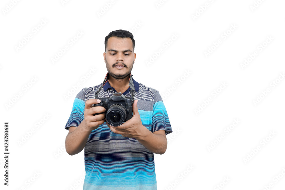 man with a professional DSLR camera, showing thumbs up, checking photos, showing the camera, operating the camera, with a blank white plate man with a professional DSLR camera, showing thumbs up, checking photos, showing the camera, operating the camera, with a blank white plate