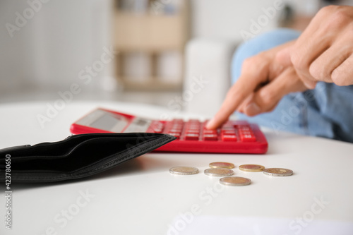 Man counting money at home,...