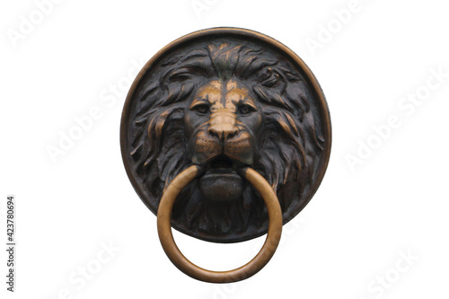 Metal decorative head of a lion with a ring in the teeth. Isolated on white background.