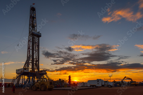 Sunrise scenery of onshore drilling rig in oil field, petroleum industry