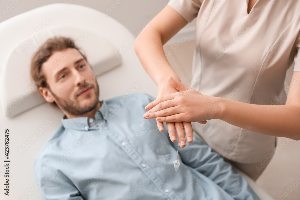 Reiki master working with patient Reiki master working with patient
