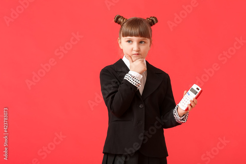 Thoughtful little schoolgir...