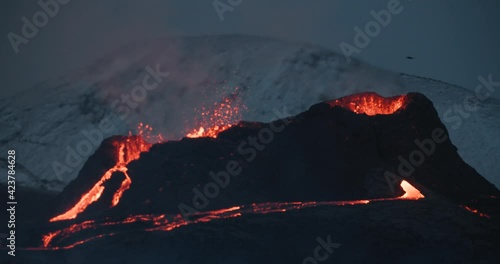 Volcano on mount Fagradalsfjall with drone flying near lava spewing crater photo