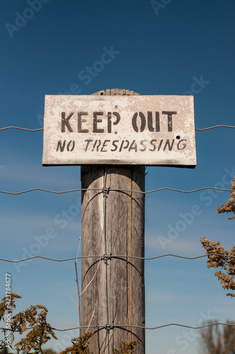 Wallpaper Mural No Trespassing sign on an old fence post Torontodigital.ca
