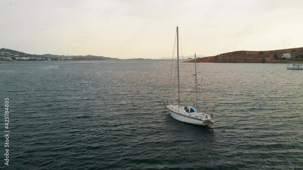 Sailboat in bay of Paros island, Greece. Aerial circling Sailboat in bay of Paros island, Greece. Aerial circling