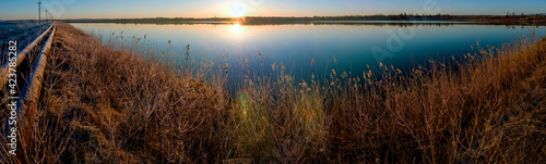 water line near the lake at sunrise and clear sky