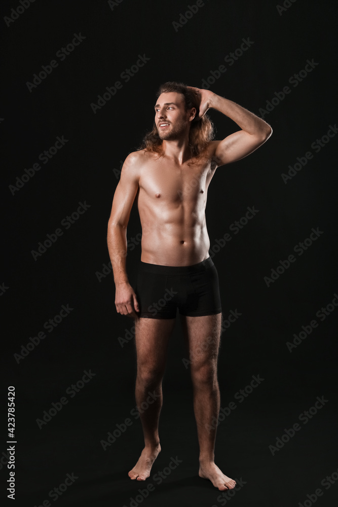 Silhouette of sexy young man on dark background Silhouette of sexy young man on dark background