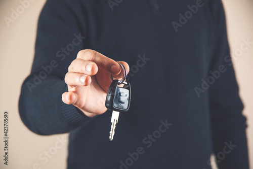 Hands of man holding the car keys