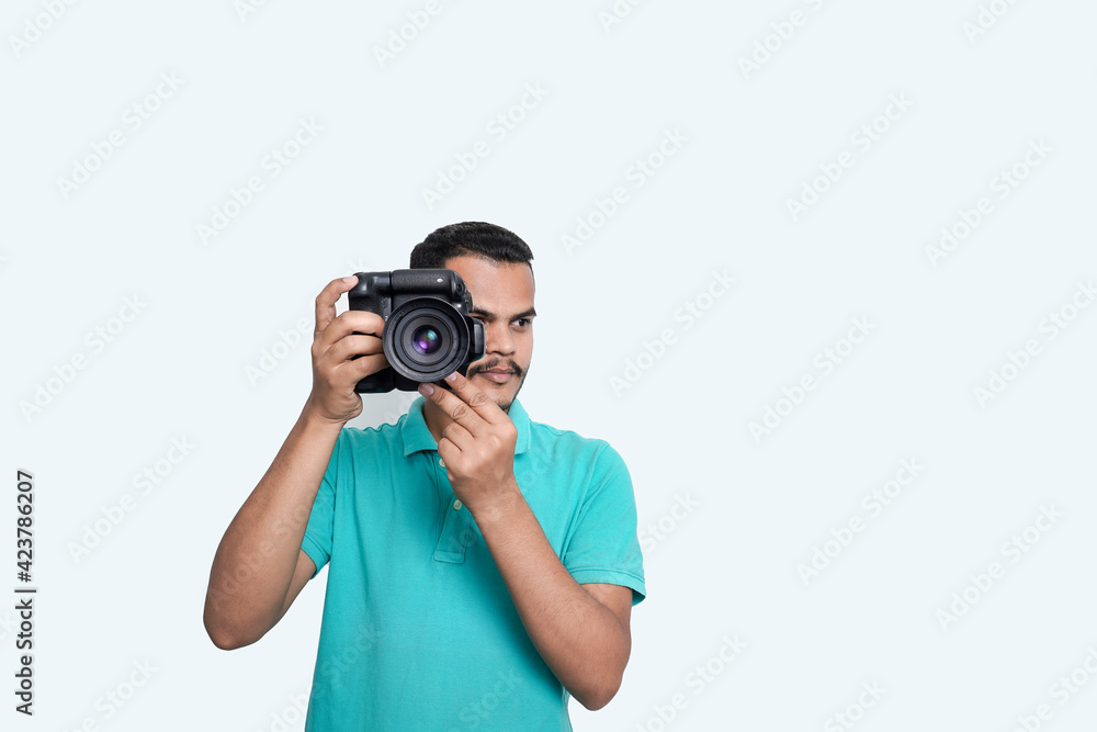 man with a professional DSLR camera, showing thumbs up, checking photos, showing the camera, operating the camera, with a blank white plate man with a professional DSLR camera, showing thumbs up, checking photos, showing the camera, operating the camera, with a blank white plate