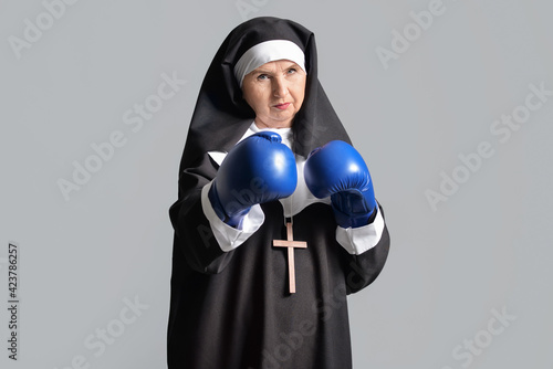 Senior nun in boxing gloves...