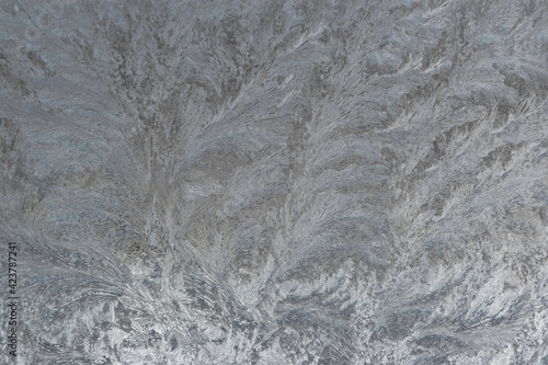 Ice texture background. Frozen window on a winter night. 