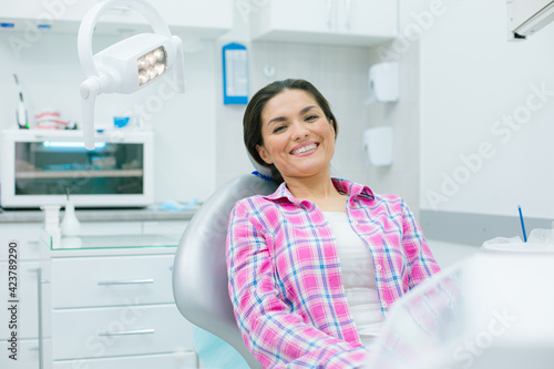 Pleased woman looking relaxed in the medical office