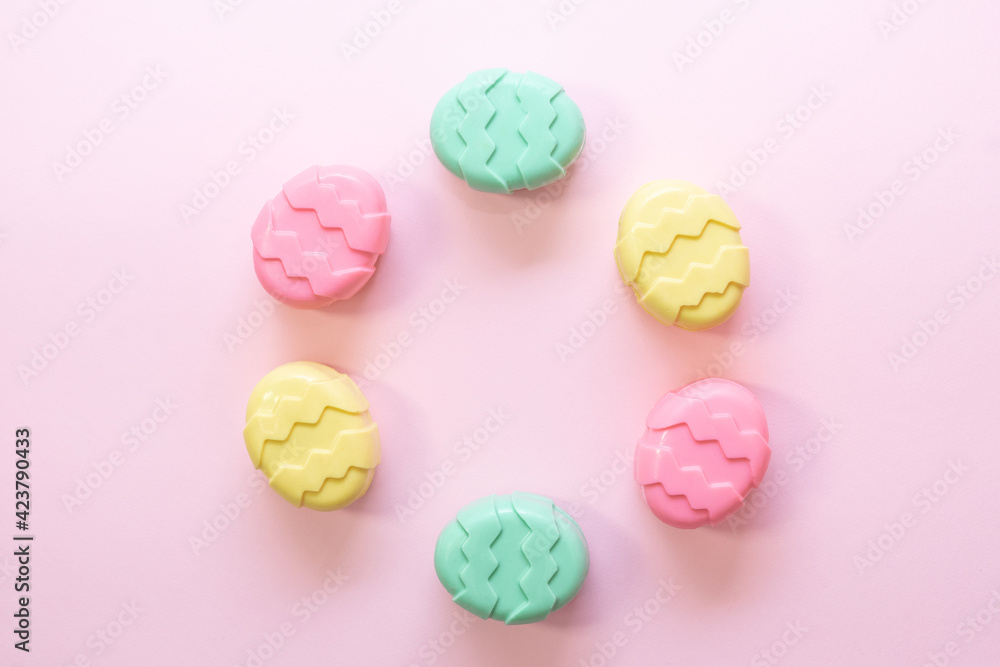 Minimalism concept of Easter candies on pink background. Flat lay. Space for text. Minimalism concept of Easter candies on pink background. Flat lay. Space for text.
